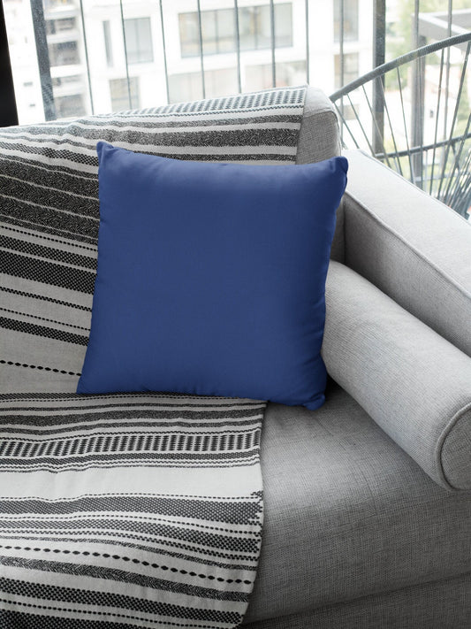 Solid Blue Pillow on Gray Couch