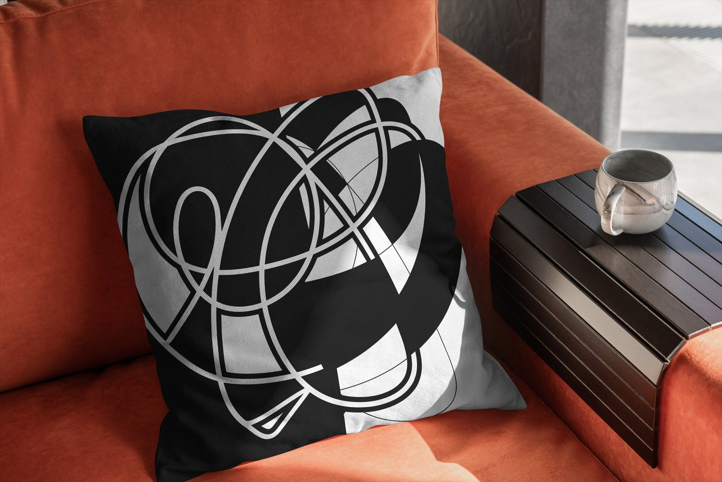 Black and White Abstract Pillow on Red Chair